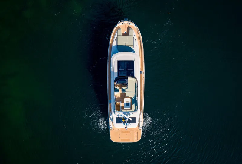 Slide: The Image of Aerial view of 2025 Nimbus 495 Flybridge yacht on open water. - 39