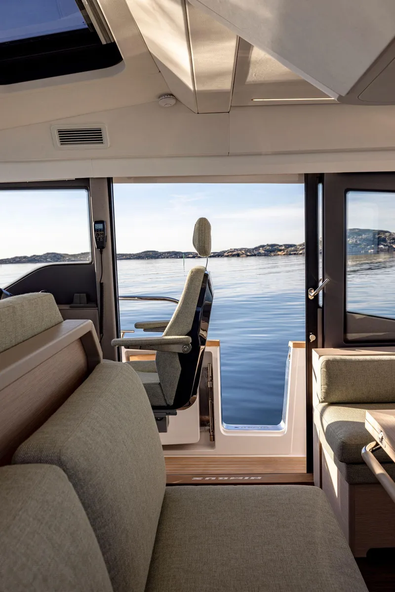 Slide: The Image of Interior of 2025 Nimbus 495 Flybridge yacht with scenic ocean view. - 46
