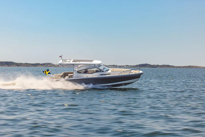 Slide: The Image of Nimbus Weekender 9 boat cruising on open water, 2025 model. - 15