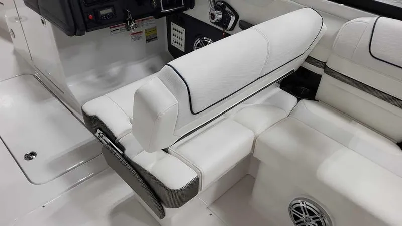 Slide: The Image of 2025 Formula 240 Bowrider interior with white seating and modern dashboard. - 11