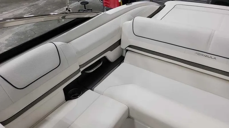 Slide: The Image of 2025 Formula 240 Bowrider interior with white seating and sleek design. - 14