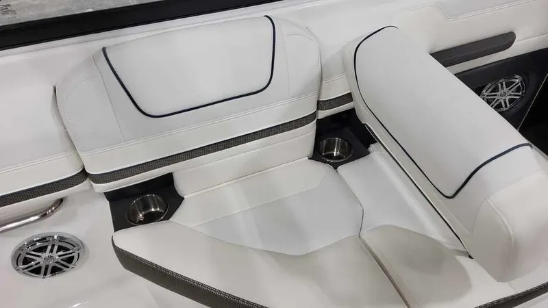 Slide: The Image of 2025 Formula 240 Bowrider interior with white seating and cup holders. - 16