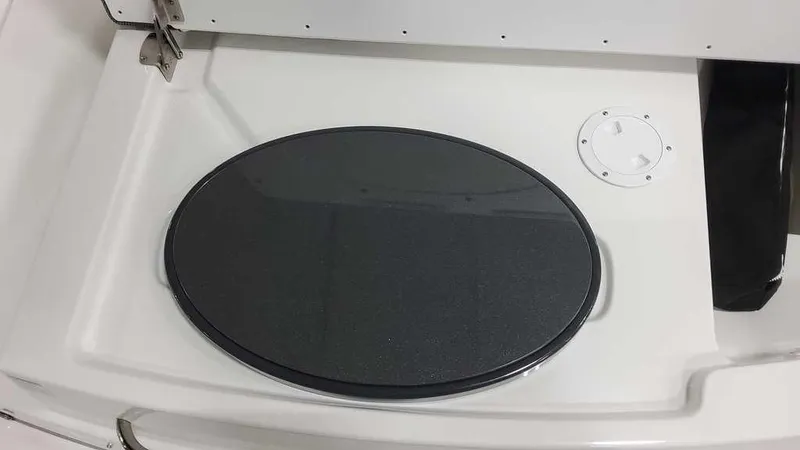 Slide: The Image of 2025 Formula 240 Bowrider boat deck with oval hatch cover. - 25