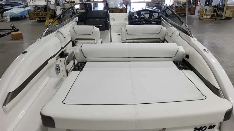 Slide: The Image of 2025 Formula 240 Bowrider boat interior with white seating and modern dashboard. - 26