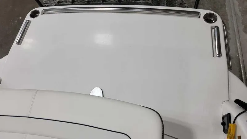 Slide: The Image of 2025 Formula 240 Bowrider boat deck with sleek white finish and stainless steel accents. - 27