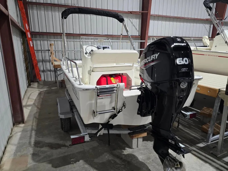 Slide: The Image of 2025 Boston Whaler 150 Montauk with Mercury 60 HP engine in storage. - 10