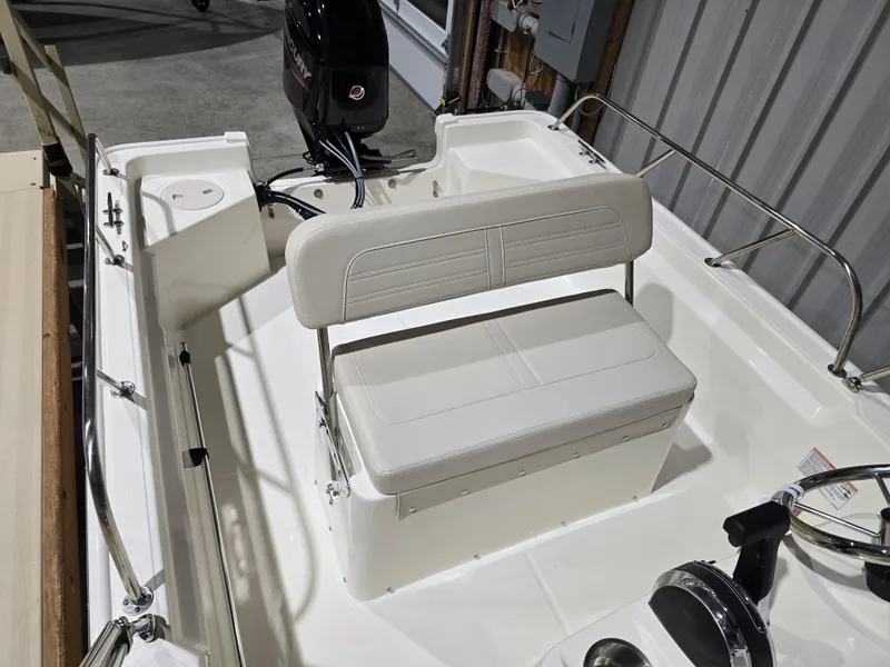 Slide: The Image of 2025 Boston Whaler 150 Montauk boat in storage, featuring sleek design and modern amenities. - 7