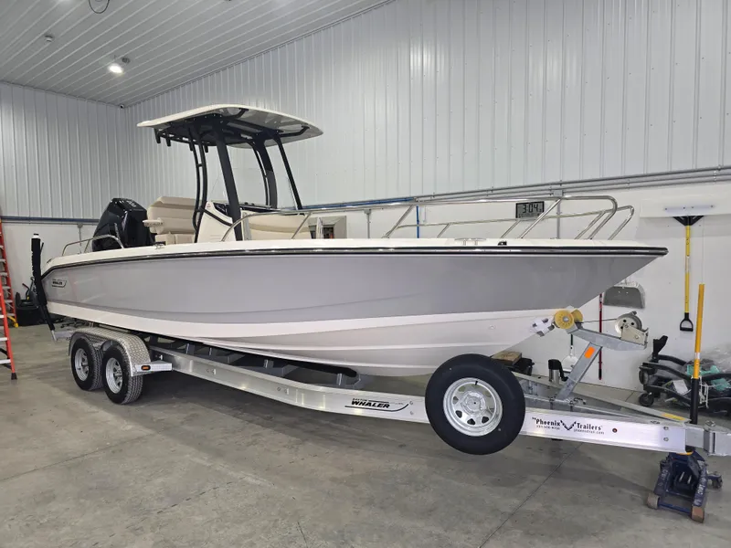 Slide: The Image of 2025 Boston Whaler 250 Dauntless boat interior with steering console and controls. - 10