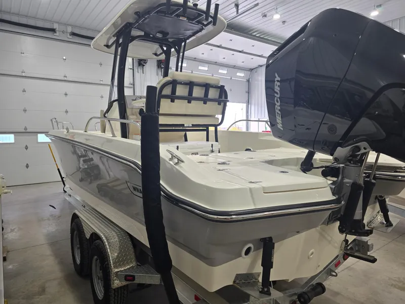 Slide: The Image of 2025 Boston Whaler 250 Dauntless boat interior with white seating. - 15