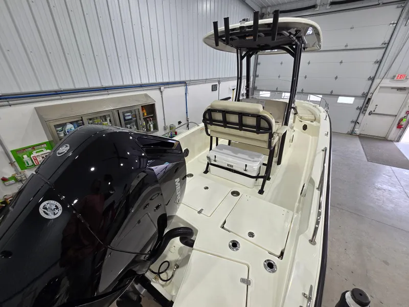 Slide: The Image of 2025 Boston Whaler 250 Dauntless storage compartment with open lid. - 16