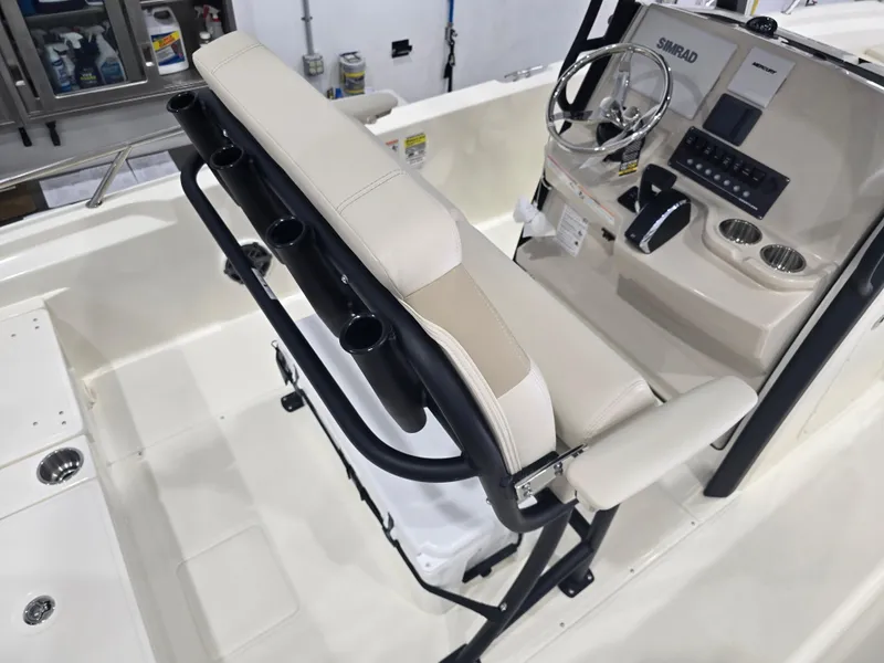 Slide: The Image of 2025 Boston Whaler 250 Dauntless boat seating, featuring beige upholstery and sturdy frame. - 18