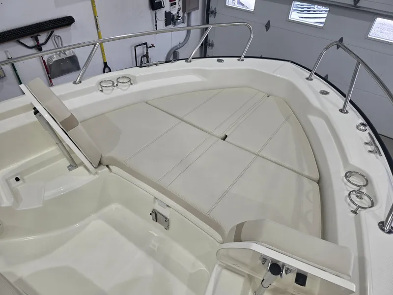 Slide: The Image of 2025 Boston Whaler 250 Dauntless boat dashboard with compass and controls. - 22