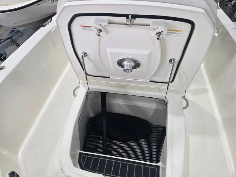 Slide: The Image of 2025 Boston Whaler 250 Dauntless boat on trailer, featuring powerful outboard motor. - 25