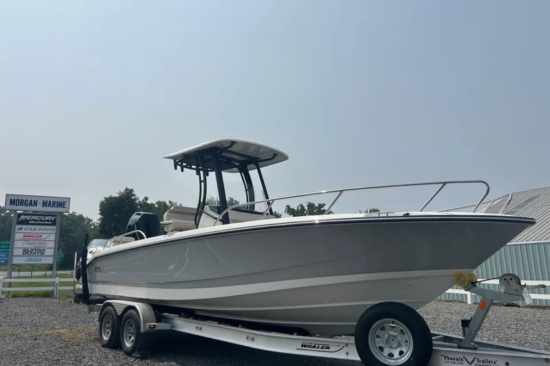 Slide: The Image of 2025 Boston Whaler 250 Dauntless interior with seating and cooler. - 8