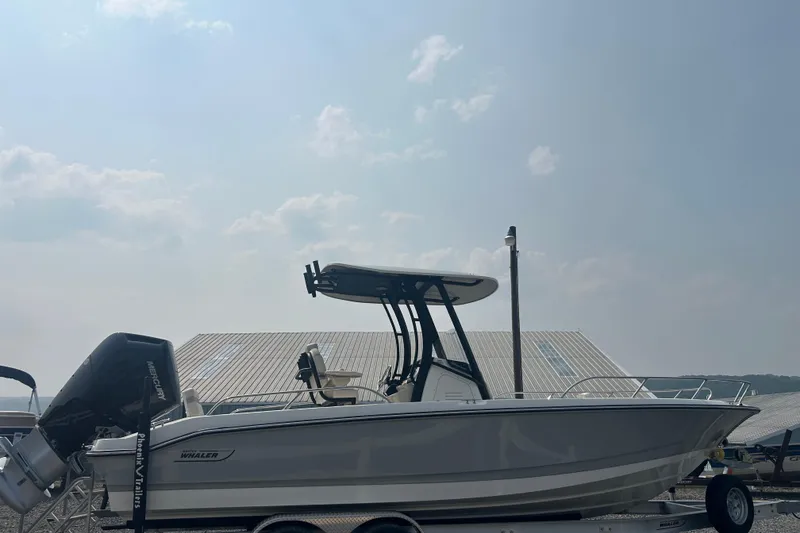 Slide: The Image of 2025 Boston Whaler 250 Dauntless boat interior with helm and seating. - 9