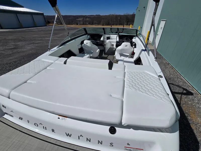 Slide: The Image of 2025 Four Winns H4 boat with spacious white seating and sleek design. - 10