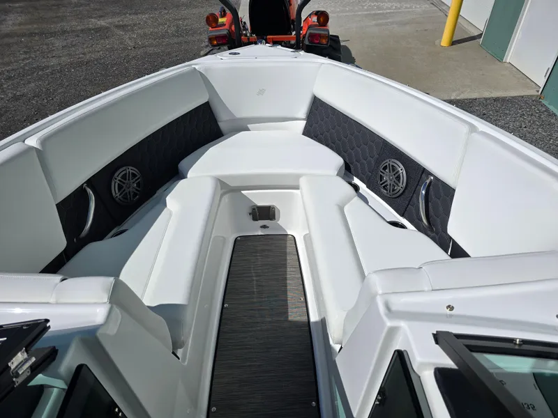 Slide: The Image of 2025 Four Winns H4 boat interior with white seating and modern design. - 16