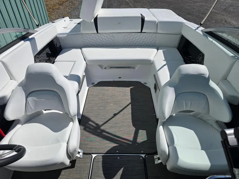 Slide: The Image of 2025 Four Winns H4 boat interior with white seating and modern design. - 19