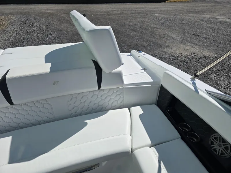 Slide: The Image of 2025 Four Winns H4 boat interior with white cushioned seating and modern design. - 24