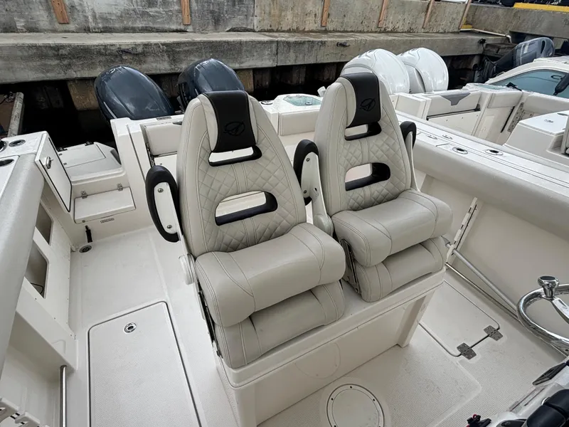 Slide: The Image of 2023 Sailfish 272 CC boat with luxurious dual captain's chairs in a sleek, modern design. - 10