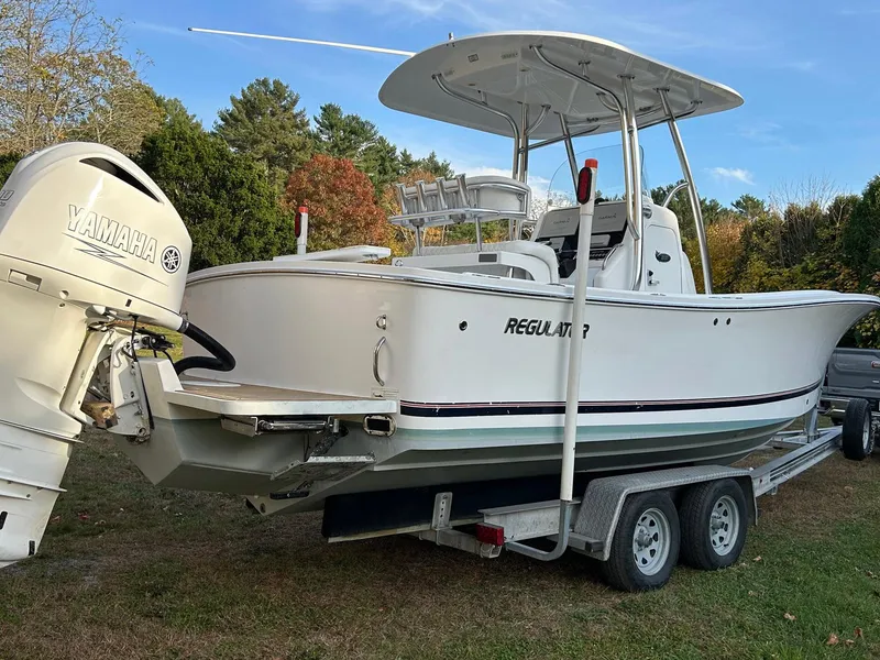Slide: The Image of 2016 Regulator 23 Forward Seating boat on trailer with Yamaha outboard motor. - 3