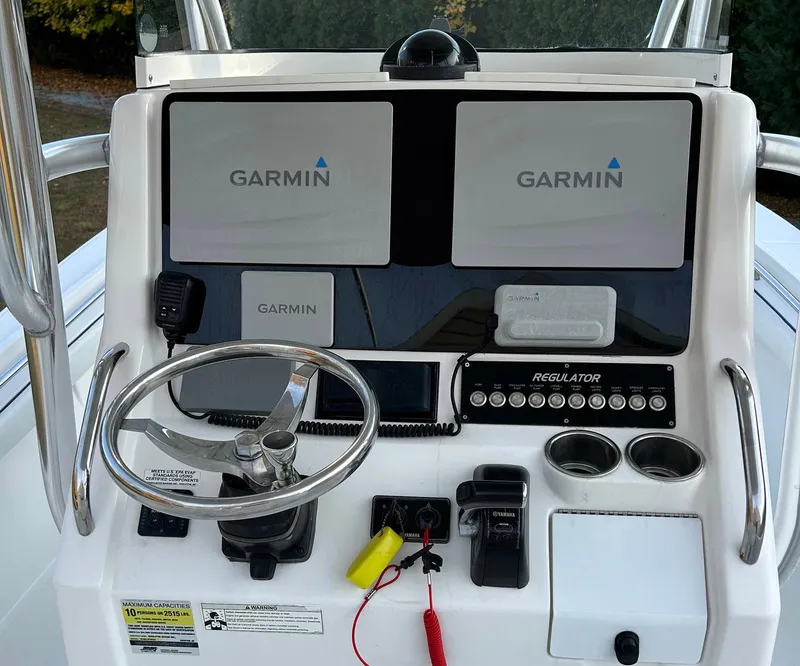 Slide: The Image of 2016 Regulator 23 Forward Seating boat dashboard with Garmin navigation system. - 7