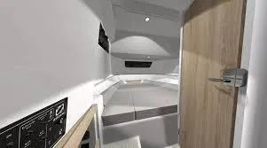 Slide: The Image of Modern interior of 2025 Zodiac X10CC boat cabin with sleek design and wood accents. - 12