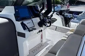 Slide: The Image of 2025 Zodiac X10CC boat interior with modern dashboard and seating. - 15