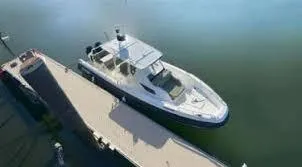 Slide: The Image of 2025 Zodiac X10CC boat docked on calm water, viewed from above. - 6