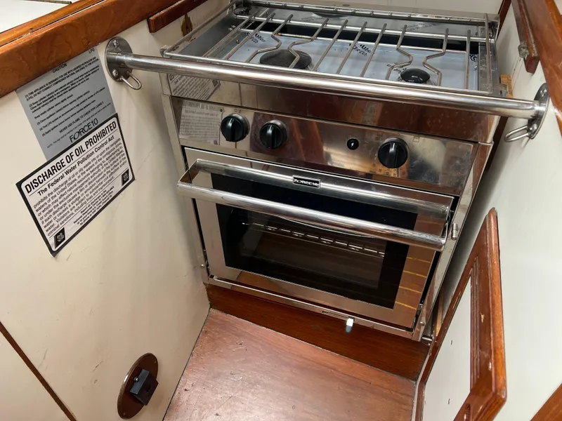 Slide: The Image of Stainless steel stove and oven in 1988 Cape Dory 30 MK II yacht kitchen. - 20