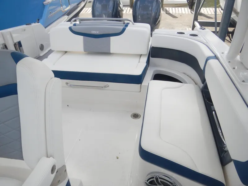 Slide: The Image of 2022 Chaparral 280 OSX boat interior with white and blue seating. - 5