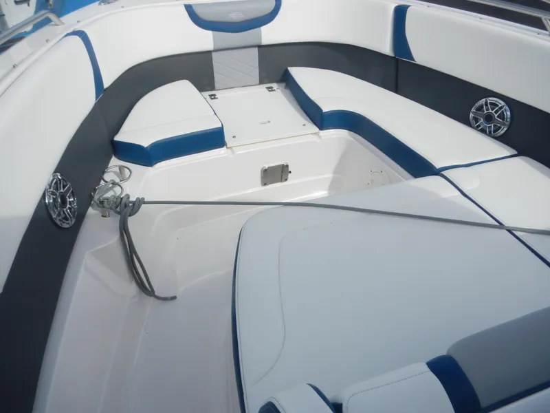 Slide: The Image of 2022 Chaparral 280 OSX boat interior with blue and white seating and anchor. - 7
