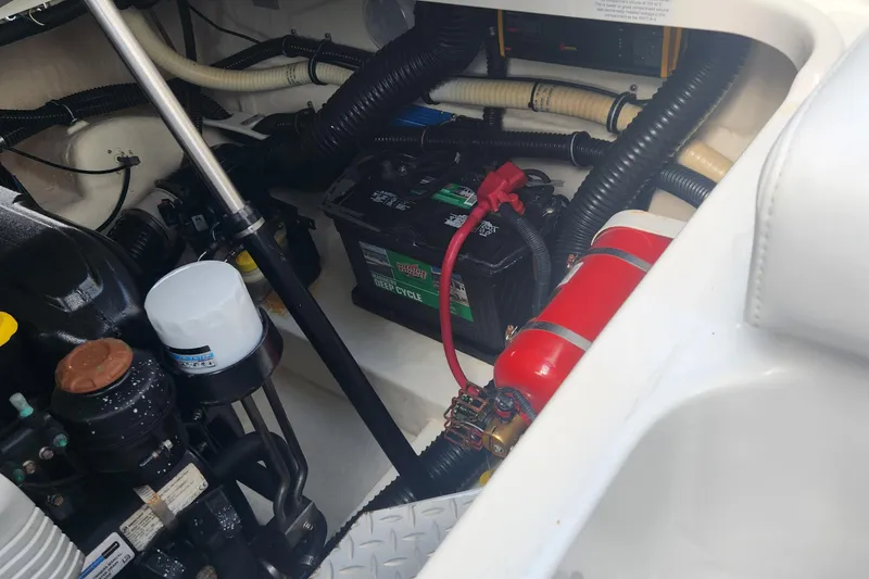 Slide: The Image of Engine compartment of 2018 Formula 270 BR boat with battery and fire extinguisher. - 11