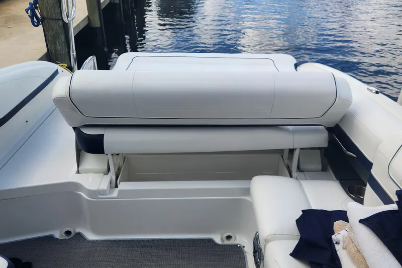 Slide: The Image of 2018 Formula 270 BR boat interior with white seating and waterfront view. - 12