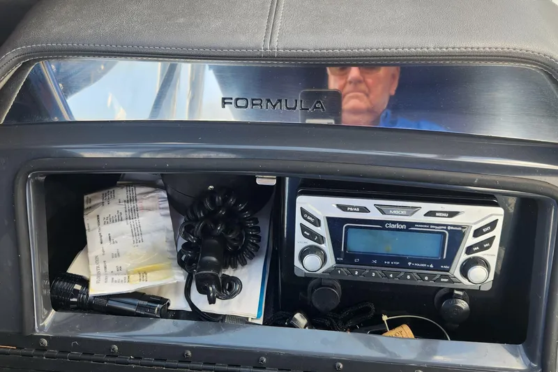 Slide: The Image of Dashboard of 2018 Formula 270 BR boat with Clarion stereo system and storage compartment. - 13