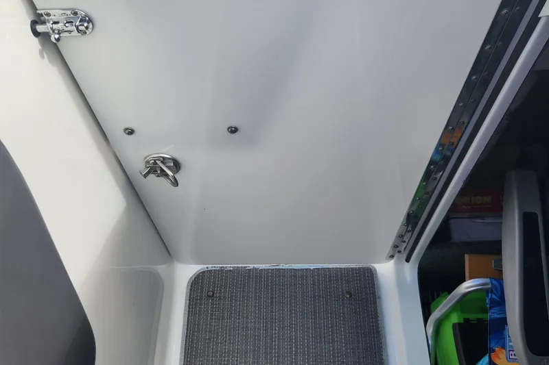 Slide: The Image of Interior view of a 2018 Formula 270 BR boat cabin with storage area. - 15