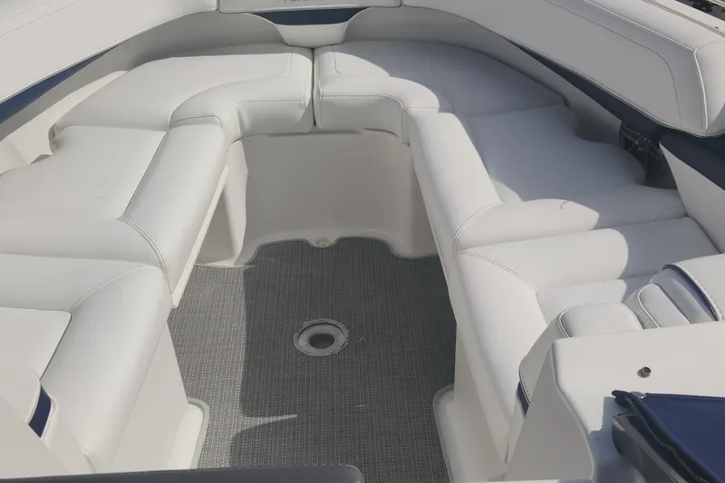 Slide: The Image of 2018 Formula 270 BR boat interior with white cushioned seating. - 16