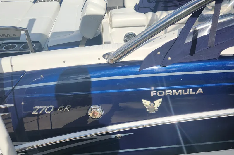 Slide: The Image of 2018 Formula 270 BR boat, blue exterior with logo and branding details. - 3