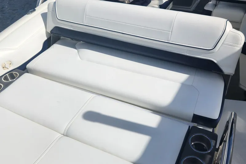 Slide: The Image of 2018 Formula 270 BR boat interior with white seating and cup holders. - 4
