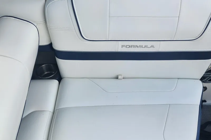 Slide: The Image of 2018 Formula 270 BR boat interior with white leather seating and cup holder. - 7
