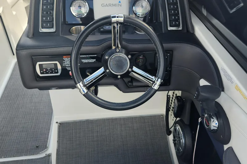 Slide: The Image of 2018 Formula 270 BR boat dashboard with Garmin navigation system and steering wheel. - 8