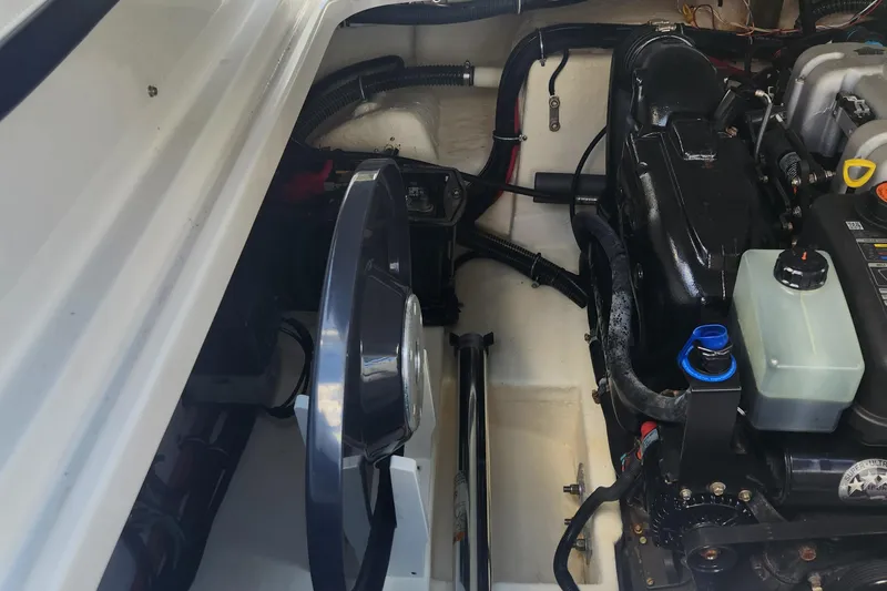 Slide: The Image of Engine compartment of a 2018 Formula 270 BR boat, showcasing mechanical components. - 9