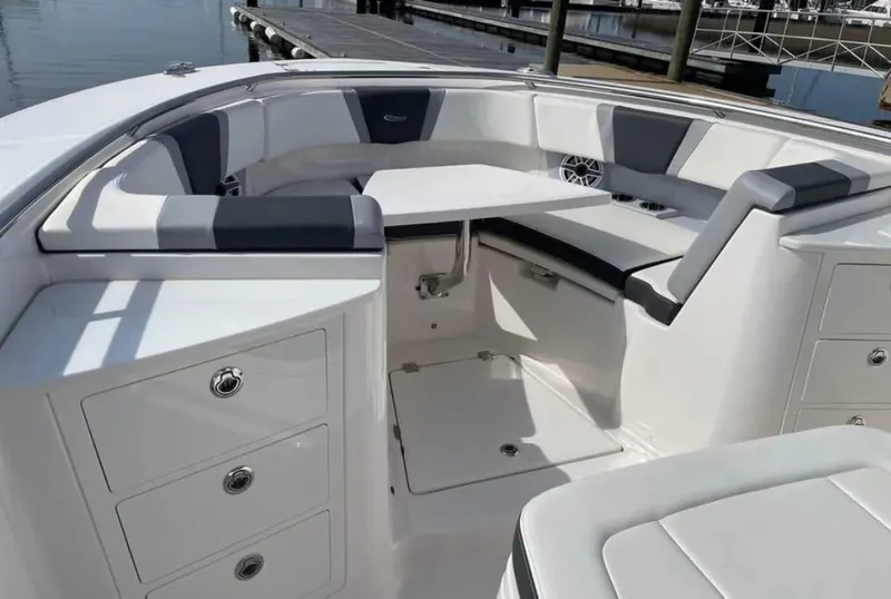 Slide: The Image of 2023 Robalo R360 Center Console boat interior with seating and storage. - 10