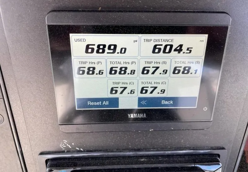 Slide: The Image of Yamaha display showing fuel usage and trip data on 2023 Robalo R360 Center Console. - 11