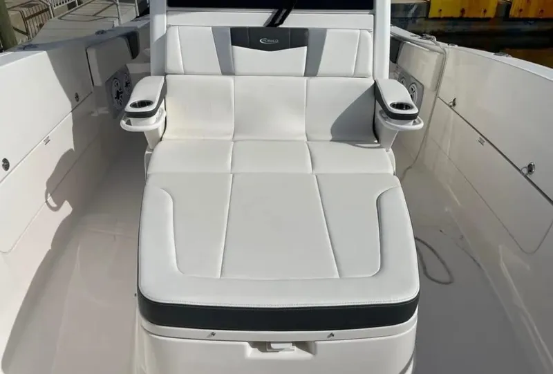 Slide: The Image of 2023 Robalo R360 Center Console boat with white cushioned seating. - 12