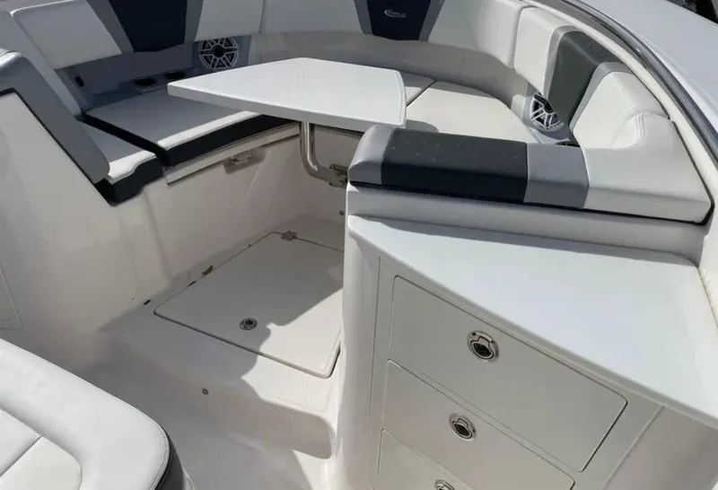 Slide: The Image of 2023 Robalo R360 Center Console boat interior with seating and storage compartments. - 5
