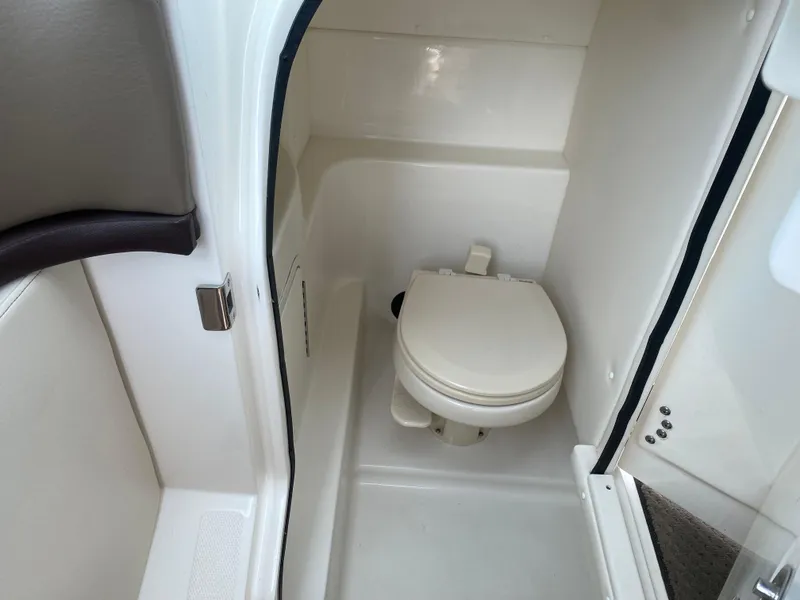 Slide: The Image of Interior of 2013 Sea Ray 270 SLX boat, featuring seating and dashboard details. - 11