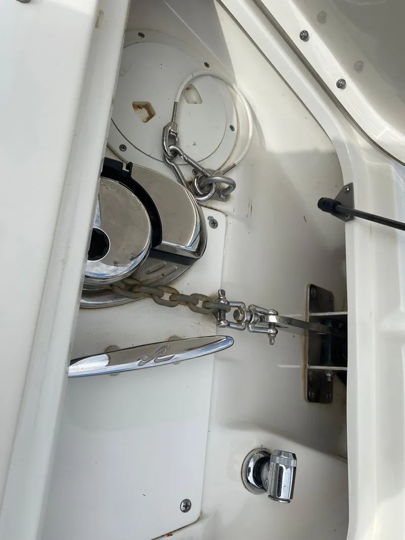 Slide: The Image of Open mini fridge on 2013 Sea Ray 270 SLX boat, showing interior shelves. - 17