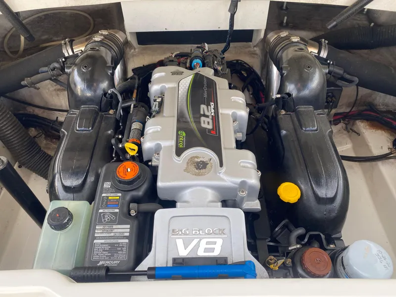 Slide: The Image of Anchor compartment of 2013 Sea Ray 270 SLX boat, featuring chain and winch. - 18