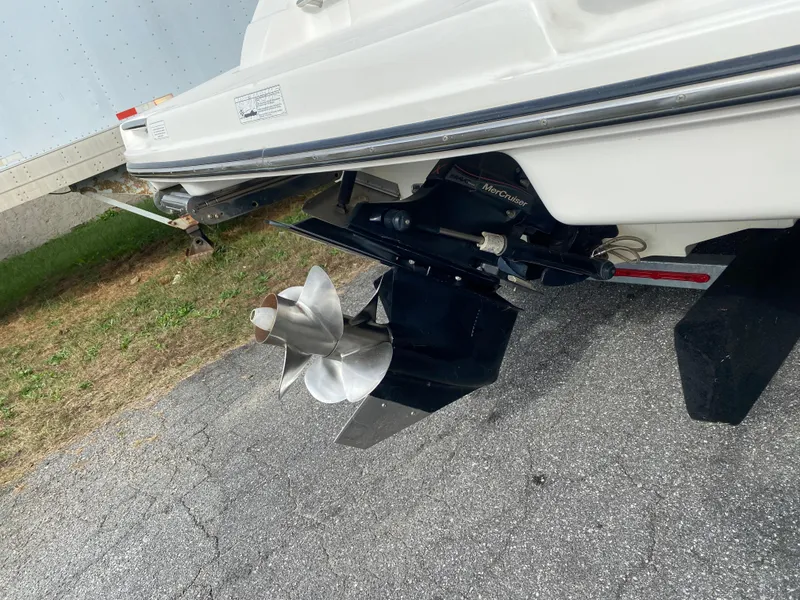 Slide: The Image of 2013 Sea Ray 270 SLX boat, rear view, parked outdoors. - 3